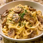 Plate of creamy mushroom pasta with garlic and parmesan sauce