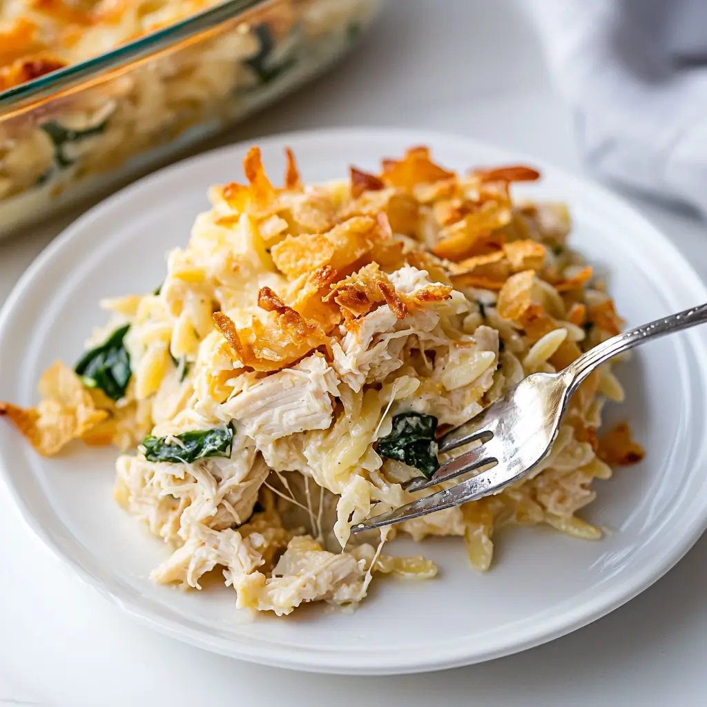 Creamy Monterey Chicken One Pan Orzo with chicken, spinach, and cheesy orzo in a baking dish.