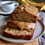 Delicious salted caramel banana bread drizzled with warm caramel sauce.