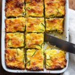 Delicious and Easy Vegetarian Zucchini Slice packed with eggs, cheese, and bacon - a classic Australian recipe.